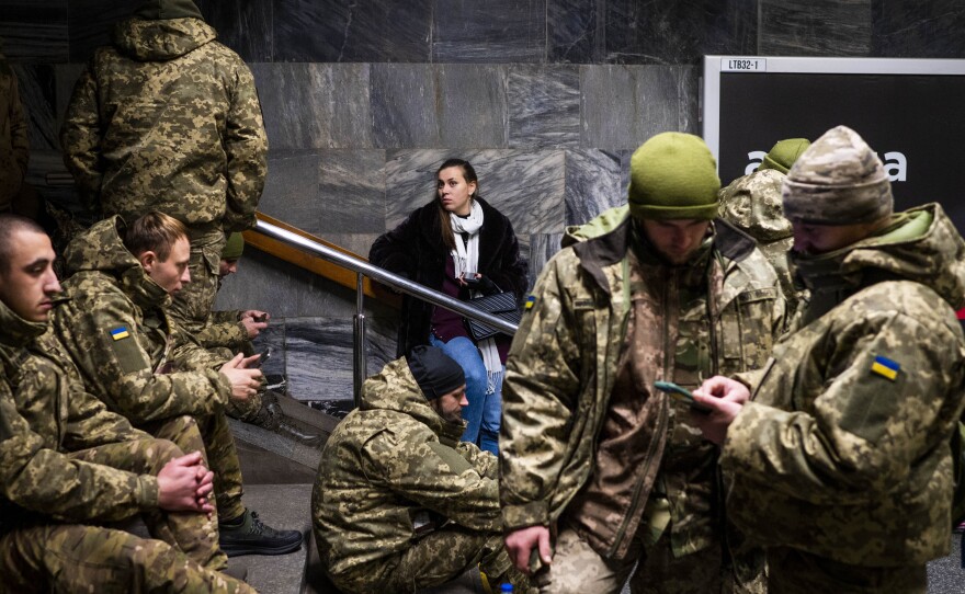 Soldiers take shelter in Lva Tolstoho Metro during an air alert on in Kyiv on Monday. Russia renewed its missile attacks across Ukraine on Monday.