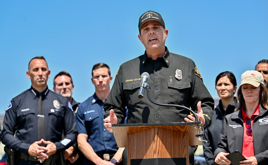 Orange County Fire Authority Division Chief Craig Covey speaks during a news conference at the Los Alamitos racetrack in Cypress, Calif., on Friday about a hazardous material situation in Garden Grove, Calif.