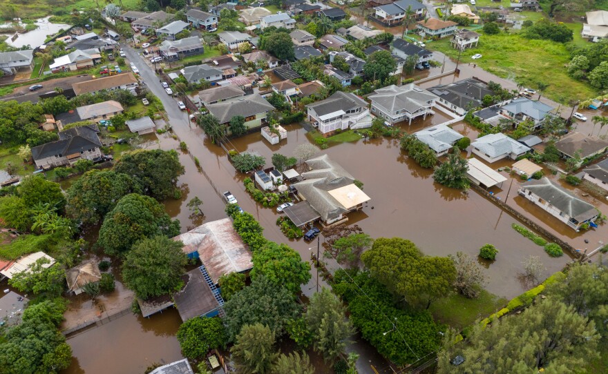 Streets are flooded from severe rains Friday in Haleiwa, Hawaii.