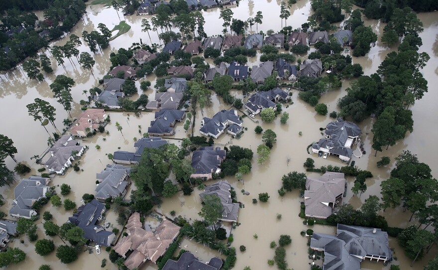 Homes near Lake Houston were almost completely under water on Wednesday. Based on the experiences of past storm victims, returning home could take years.