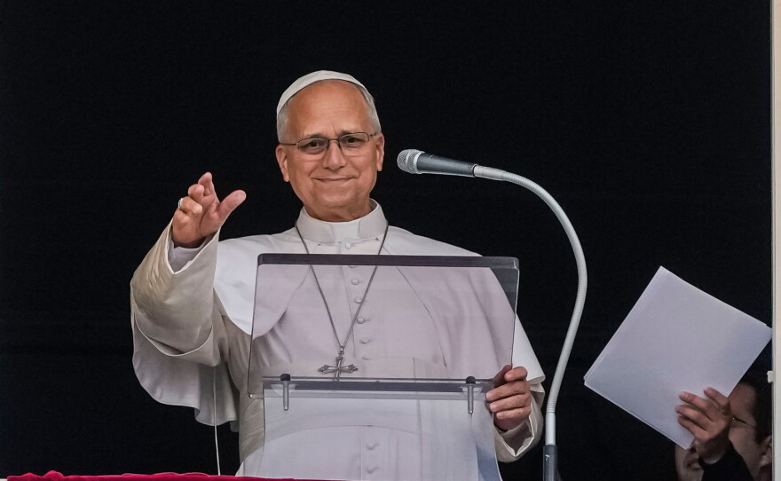 Pope Leo XIV appears at the window of his study in the Apostolic Palace overlooking St. Peter's Square at the Vatican for the traditional noon blessing after praying the Angelus, Sunday, Oct. 18, 2026, a day after he returned from the hospital, where he had lung cancer removed on Tuesday.