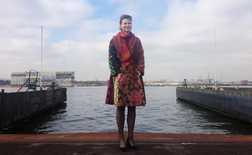 Marjam Minnesma, director and founder of the Dutch environmental group Urgenda, stands outside her offices at the harbor overlooking central Amsterdam. The group has filed a lawsuit against the government saying it has not done enough to protect citizens and must cut back more on carbon emissions.
