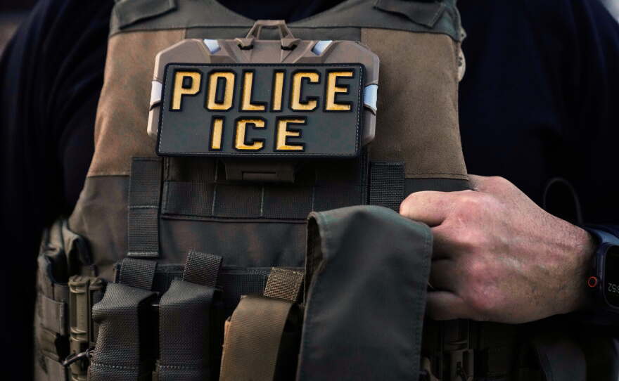 A U.S. Immigration and Customs Enforcement agent is seen in Park Ridge, Ill., Sept. 19, 2025.