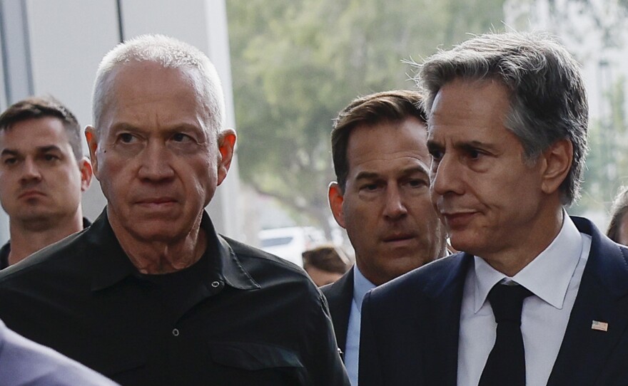 U.S. Secretary of State Antony Blinken and Israeli Cabinet Minister Benny Gantz, left, walk as they meet during his week-long trip aimed at calming tensions across the Middle East in Tel Aviv, Israel, on Tuesday.