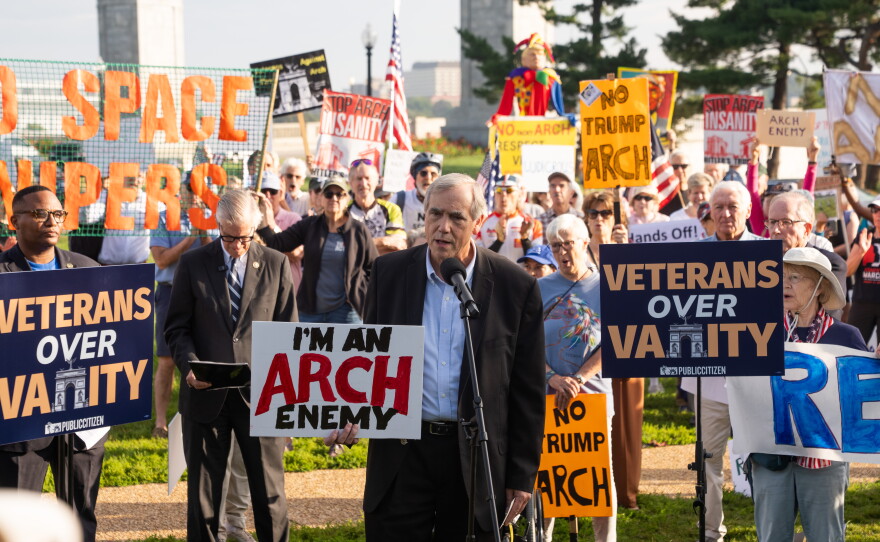 Sen. Jeff Merkley, D-Ore., speaks to demonstrators at Thursday's event. His efforts to block federal funding for the arch were rejected by a GOP senator earlier in the week.