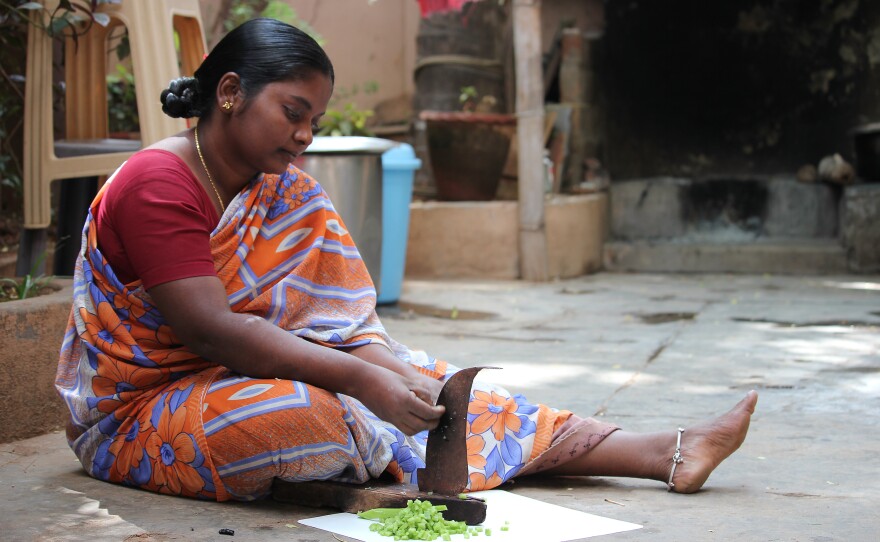 Elizabeth, a single mother of four, says her village has "lots of electricity." What she'd like is better bus service.