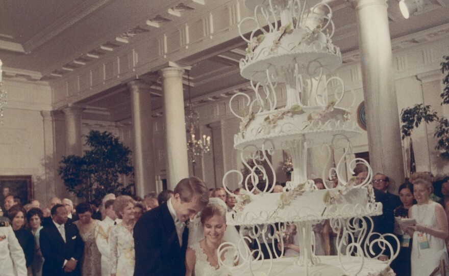 Tricia Nixon cuts into her wedding cake with her husband, Edward Cox, on June 12, 1971.