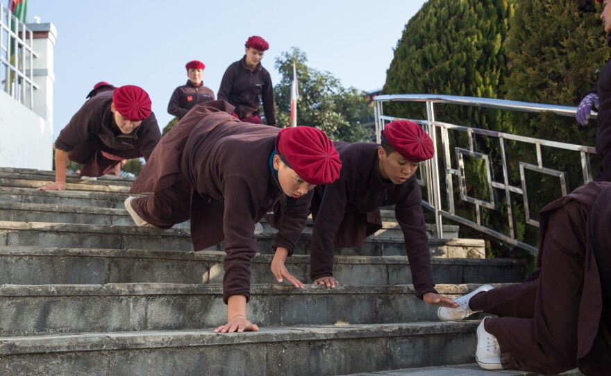 Nuns crawl down 200 stairs as a part of their morning warm-up.