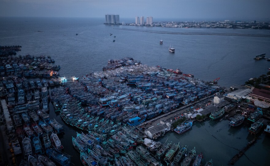 A drone image of the largest commercial fish port in Indonesia, Muara Angke, where hundreds of commercial fishing vessels are docked, in Jakarta, Indonesia, on June 15, 2025.