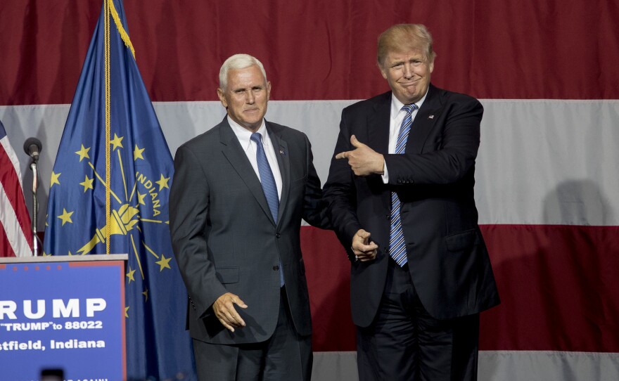 Donald Trump greets Indiana Gov. Mike Pence at the Grand Park Events Center on Tuesday in Westfield, Ind.