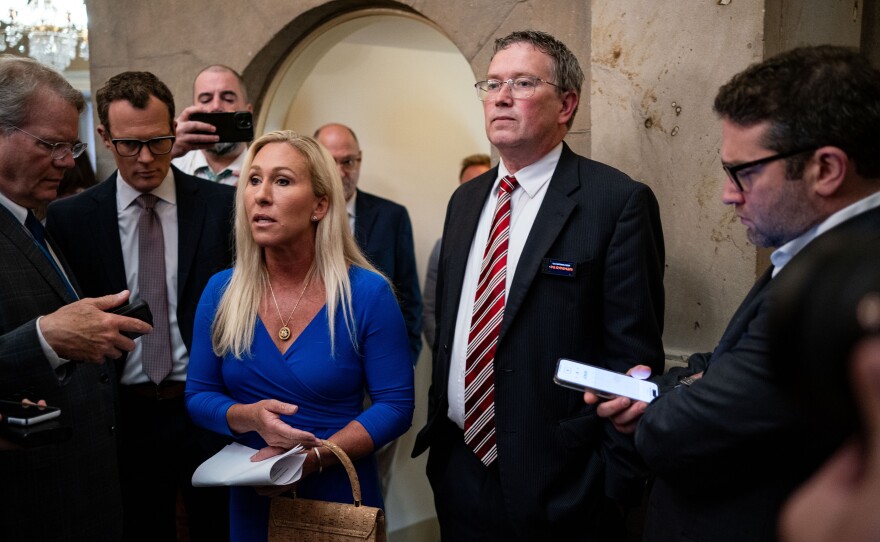 Rep. Marjorie Taylor Greene and Rep. Thomas Massie are seen here arriving for a meeting with Speaker of the House Mike Johnson on May 7.