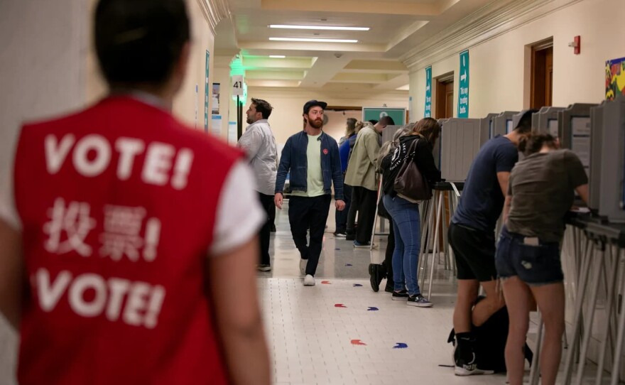 Voters fill out their ballots at San Francisco City Hall on Super Tuesday in 2020.