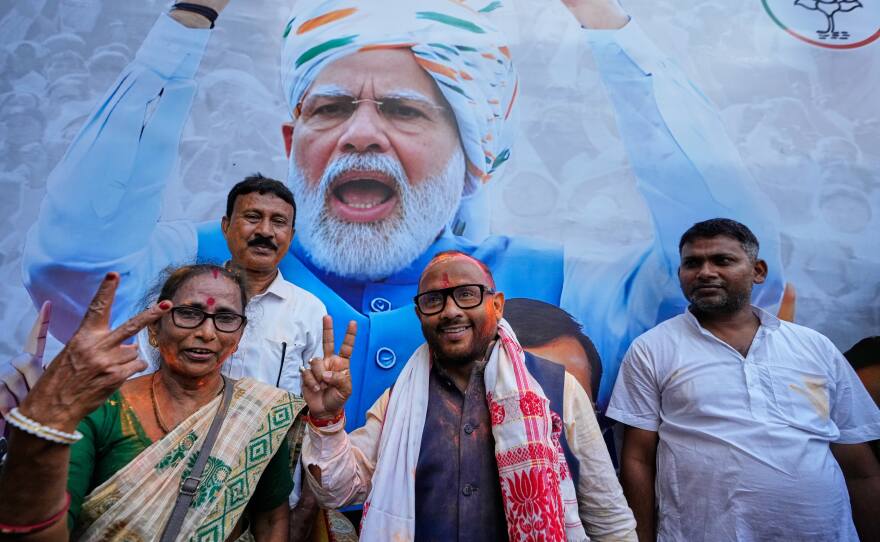 Diplu Ranjan Sarmah, center, New Guwahati candidate of Bharatiya Janata Party shows victory sign after winning in recent held state election in Guwahati, India, Monday, May 4, 2026.