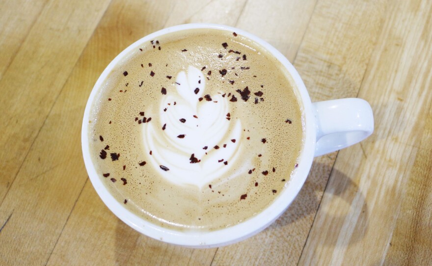 KIPP high school students are training to pour a perfect Bongo East latte, decorated with the quintessential leaf design on top.