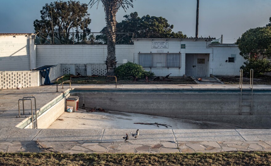 A swimming pool lies empty in the town of Kleinzee in the Namaqualand region of South Africa. The town was once the property of the De Beers diamond company. In its heyday, it was a thriving settlement of 4,000 people with about 30 recreational clubs. After closing down its mines in the region, De Beers sold off the town, which is now largely empty.