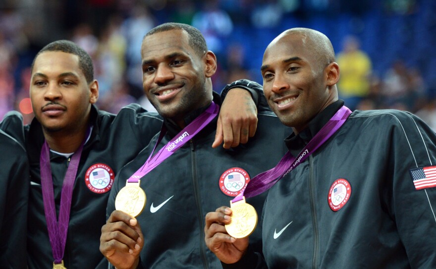 Bryant (right) celebrates with Lebron James (center) and Carmelo Anthony after winning the men's basketball gold medal at the 2012 Summer Olympics in London.