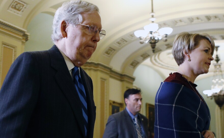 Senate Majority Leader Mitch McConnell, R-Ky., walks out of the Senate chamber after Thursday's proceedings in the impeachment trial of President Trump.