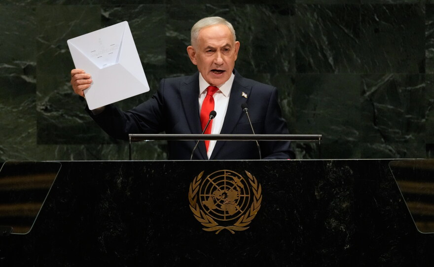 Israeli Prime Minister Benjamin Netanyahu holds up a Starlink satellite internet dish a he speaks during the 81st session of the United Nations General Assembly at United Nations headquarters, Thursday, Sept. 24, 2026.