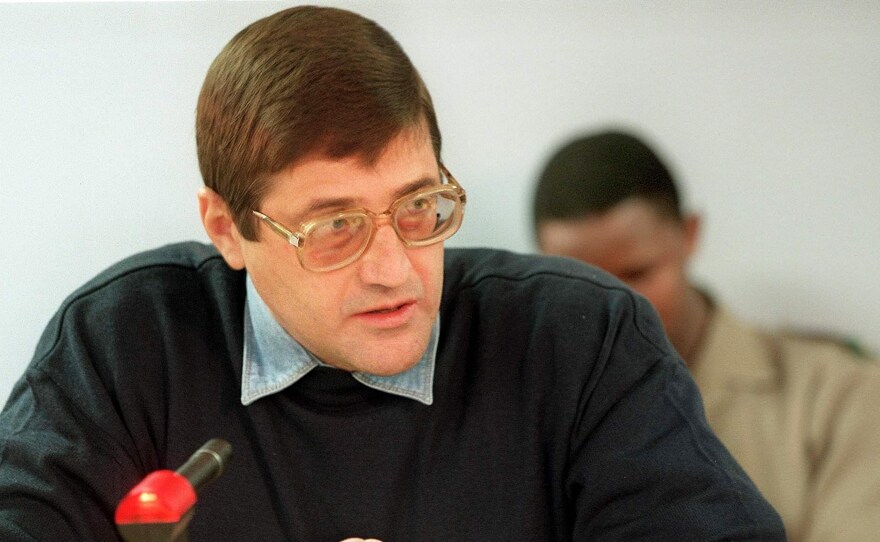 Eugene De Kock a former Vlakplaas commander speaks to the judge at a Truth and Reconciliation Commission in 1999. De Kock, the apartheid regime's top assassin, asked the commission for amnesty for over 100 incidents of torture, murder and fraud.