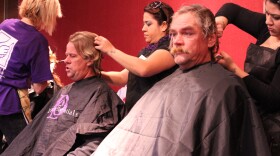 Homeless men get haircuts at Project Homeless Connect in San Diego's Golden Hall, January 5, 2011.