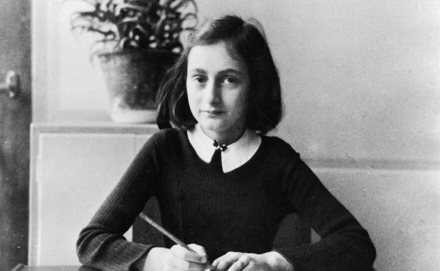 Anne Frank doing her homework in 1941.