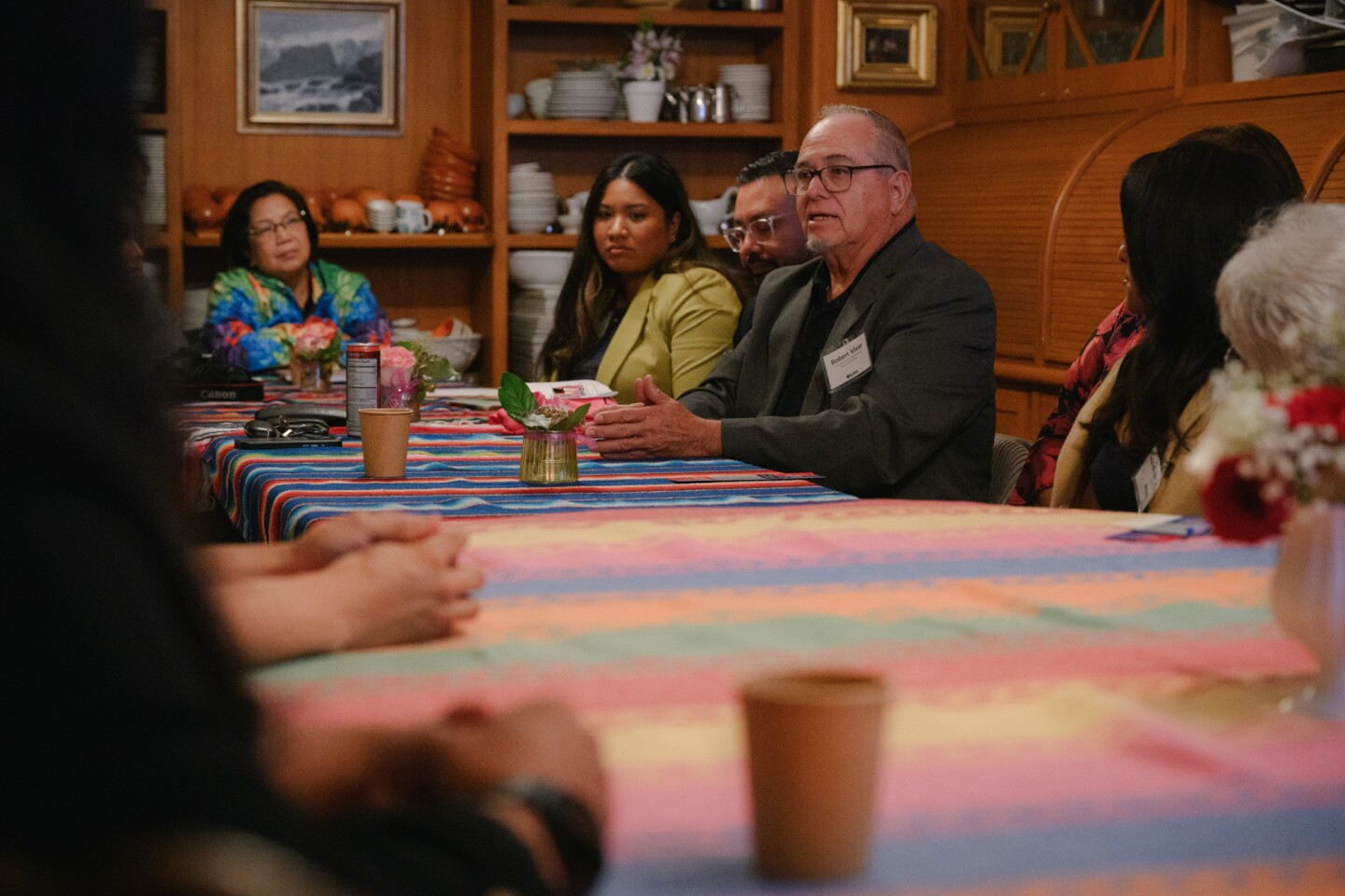 Event participants talk during KPBS' South Bay elections engagement event at Olivewood Gardens and Learning Center in National City, California on October 24, 2024.