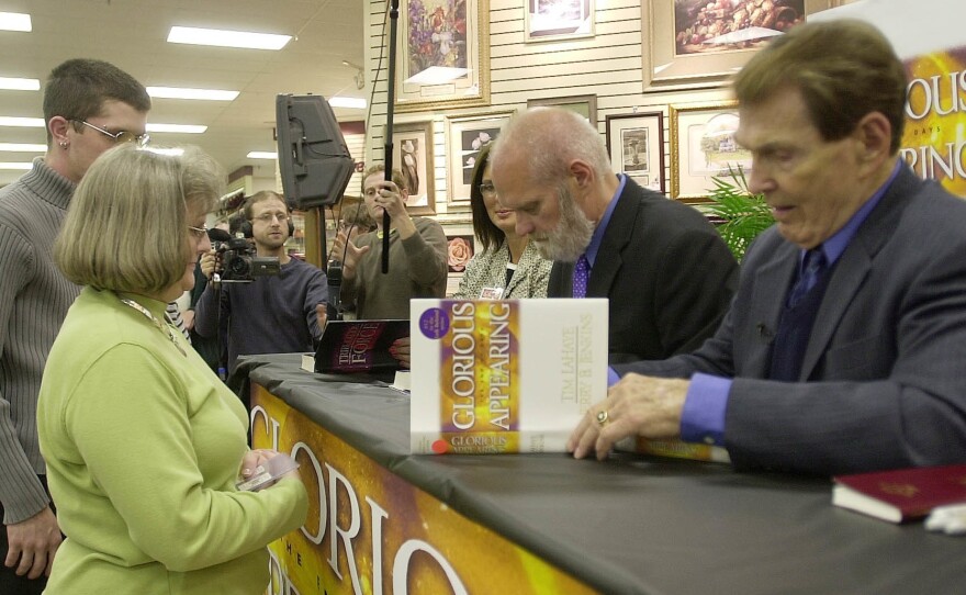 Tim LaHaye (right) and Jerry B. Jenkins sign the 12th book in the <em>Left Behind</em> series at a store in Spartanburg, S.C., in 2004.