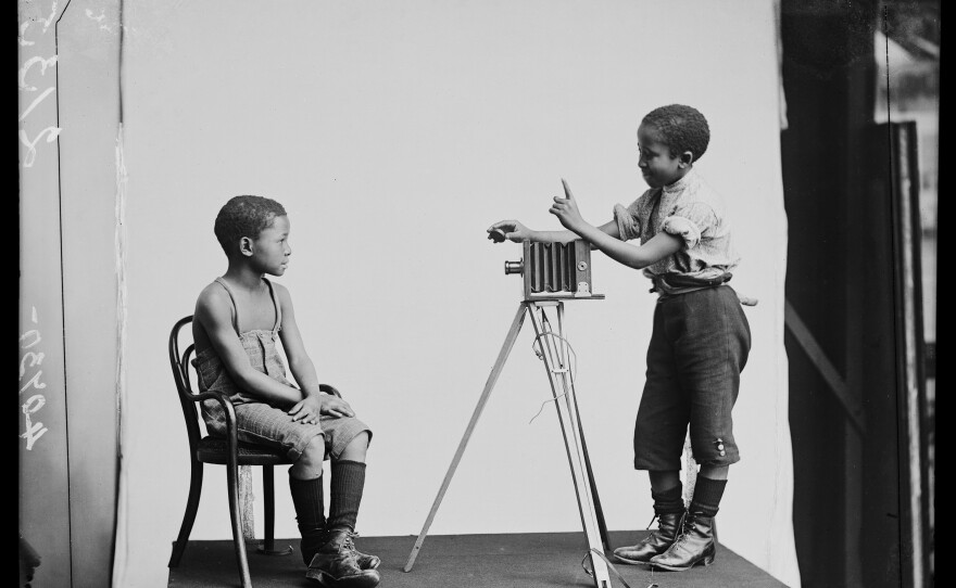 South African singers Albert Jonas and John Xiniwe, of The African Choir, in a staged photographic portrait.