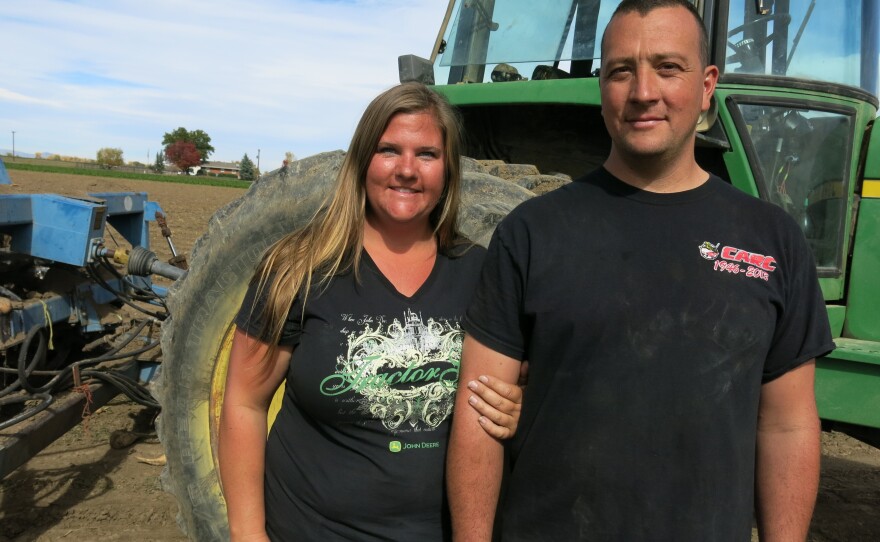 Sondra Pierce and her husband, Matt Pierce, stand in the middle of one of their sugar beet fields in rural Boulder County, Colo.