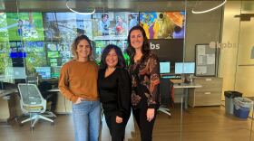 The image is a photograph of Lilly Ribner, Martha Rañón, and Shannon Patel at KPBS on December 1, 2025.