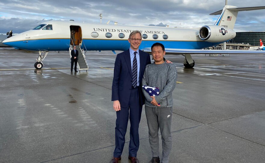 Xiyue Wang (right) stands with Brian Hook, the U.S. special representative for Iran, after a prisoner exchange late last year in Zurich, Switzerland.