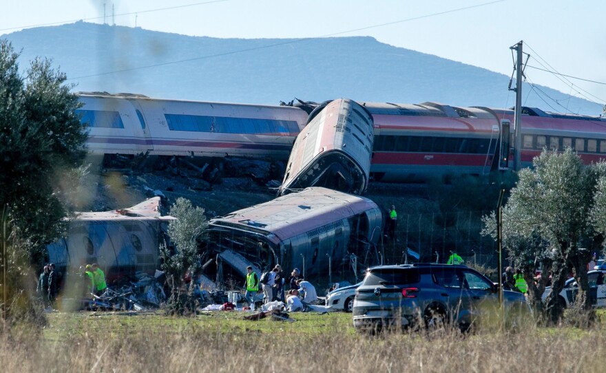 Emergency services attend to the victims at the scene of a collision between two trains in Urda, Spain, on Wednesday.