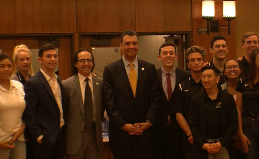 San Diego County Registrar of Voters Michael Vu and California Secretary of State Alex Padilla pose for a photo with San Diego State University students, Feb. 3, 2016.