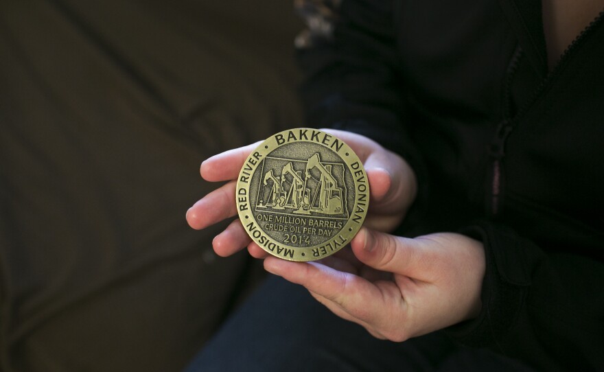 Debee holds a medal she received during her internship.