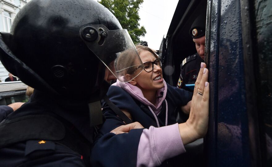Police officers in downtown Moscow detain Sobol on her way to an Aug. 3 unsanctioned rally demanding fair elections.