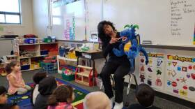 Dental hygienist Deborah Delfino shows a group of preschoolers in Lathrop, California how to brush their teeth by demonstrating with a puppet named Bob in this undated photo. 