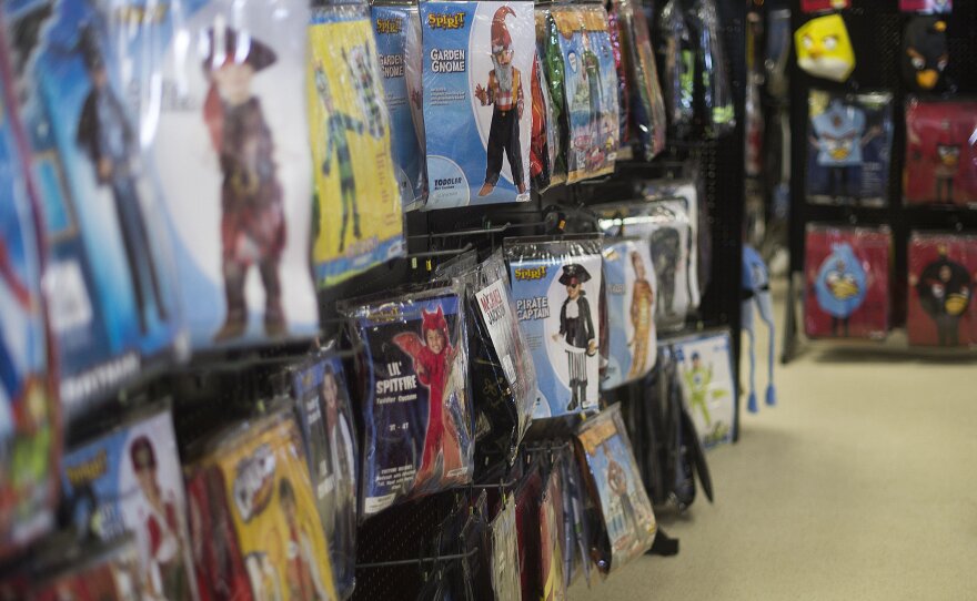 Children's Halloween costumes hang on a wall at Spirit Halloween costume store in Easton, Md., in October 2013. The stores offer Halloween supplies for a limited time during the season.