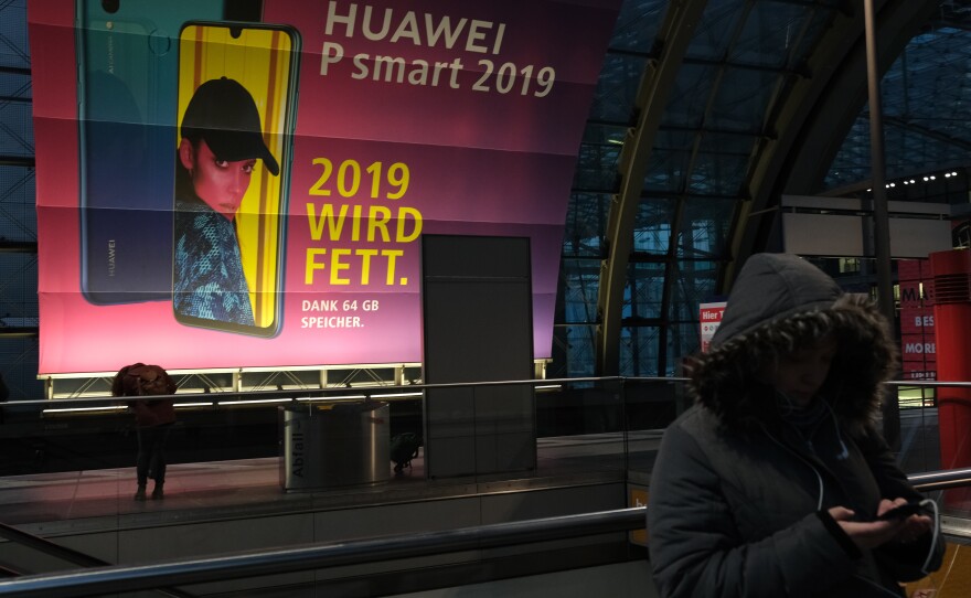 The U.S. has warned Germany about possible repercussions of using Huawei in its upcoming 5G mobile network, citing security concerns. Here, a billboard for the Chinese telecom giant is seen in the Berlin Hauptbahnhof railway station.
