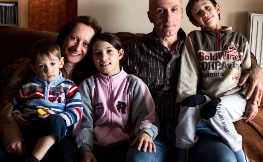 Alexandra Tsitoura and Nikos Aivatzidis with their three children, Marios, 2, (left), Fani, 9, and Dimitris, 6, in their home in Athens.