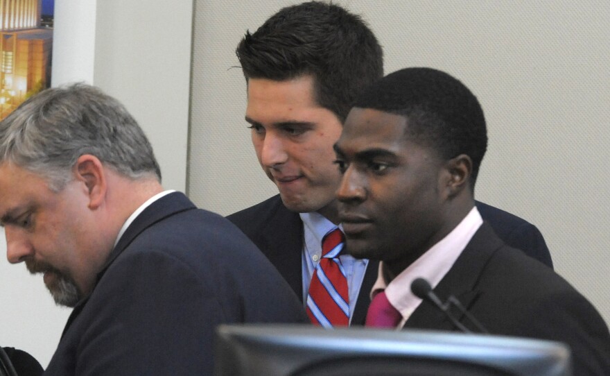 The defense gatherers after the jury was read the charges against Brandon Vandenburg, center, and Cory Batey, right, in Nashville Tuesday. The pair were found guilty of aggravated rape and aggravated sexual battery.