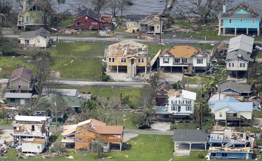 Damaged buildings and homes are damaged in the aftermath of Hurricane Laura near Lake Charles, La., Thursday.
