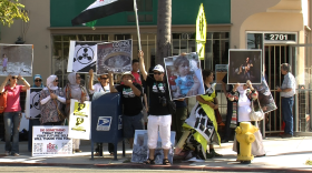 People rally outside of Rep. Susan Davis' (D-Calif.) office to urge support for U.S. military action in Syria, on Sept. 6, 2013,