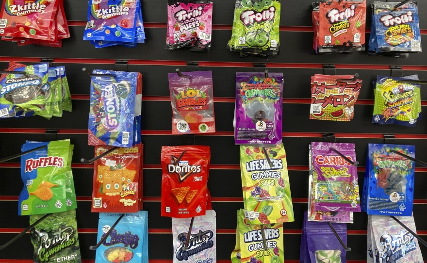Edible products advertised as containing delta-8 THC offered for sale at a smoke shop in Seattle in 2022. Teens can overdo it with products like these, health officials warn.