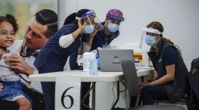 UC Davis Medical Center nurses, from left, Analyn Corpuz, Raenne Takara and Heather Donaldson review the process of inoculating with the Pfizer-BioNTech COVID-19 vaccine, Tuesday, Dec. 15, 2020 in Sacramento, Calif. 