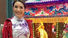 Sophia Ng stands next to a shrine at the 2019 Lunar New Year Parade in San Francisco. Born in Hong Kong, Ng emphasizes cultural awareness in her work as a mental health therapist and often counsels members of the Asian American community.