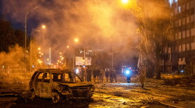 A burned car is seen after a Russian missile attack in Kyiv, Ukraine, Saturday, Aug. 1, 2026. (AP Photo/Dan Bashakov)