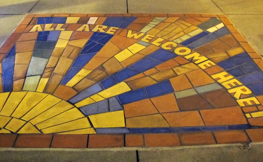 A mosaic in the sidewalk in front of Countryside United Church of Christ in Omaha. "We love our building. There is literally no good reason to move whatsoever, except to follow this Tri-Faith Initiative," says the Rev. Eric Elnes.