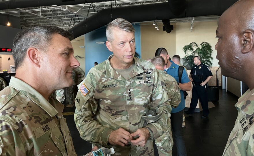 Gen. Daniel Hokanson, chief of the National Guard Bureau (center), is briefed on relief efforts at the Southwest Florida International Airport in Lee County on Saturday. <strong></strong>The National Guard is part of relief and recovery efforts after Hurricane Ian struck the state.