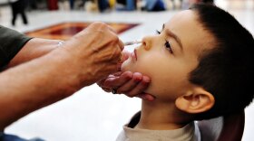 A 5-year-old boy receives the H1N1 flu nasal mist Wednesday in Rockville, Md.