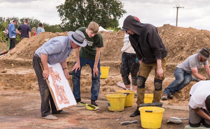 Rutland Villa Project. David Neal making notes on his illustration during the excavation of the mosaic.